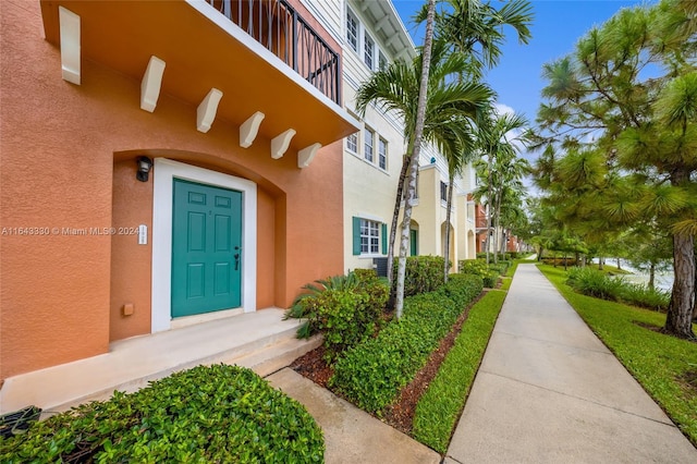 entrance to property with a balcony