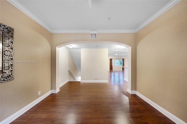 interior space featuring dark hardwood / wood-style floors and crown molding