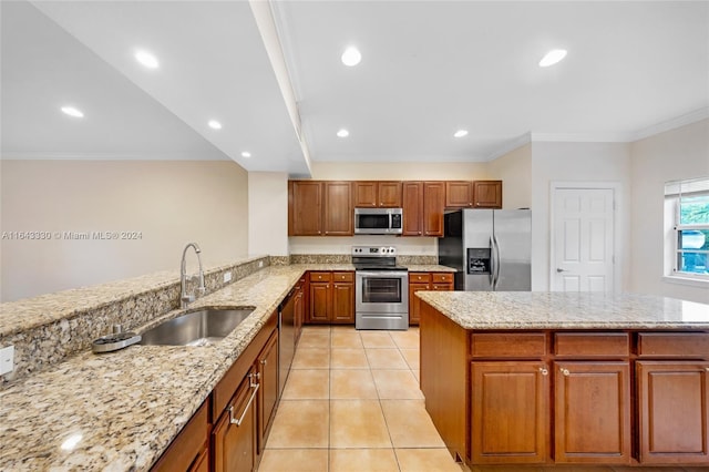 kitchen with crown molding, sink, light stone countertops, light tile patterned floors, and stainless steel appliances