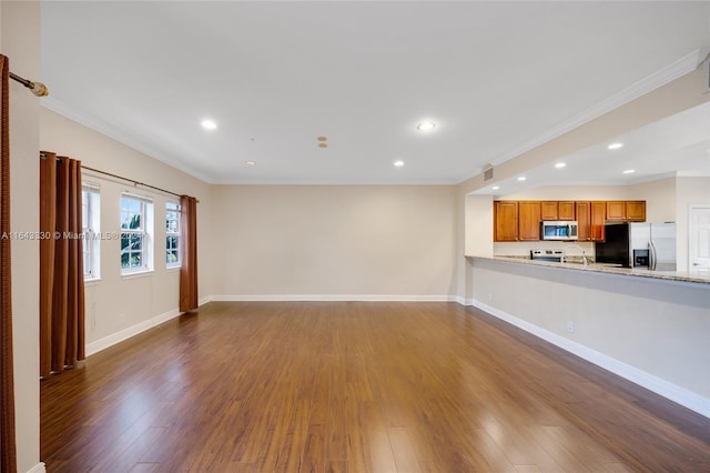 unfurnished living room featuring dark hardwood / wood-style floors and ornamental molding