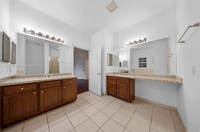 bathroom featuring tile patterned flooring and vanity