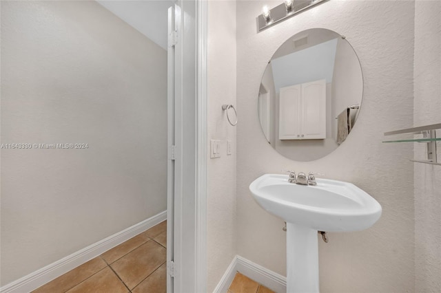 bathroom with tile patterned flooring