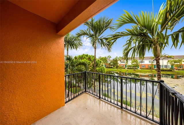 balcony featuring a water view