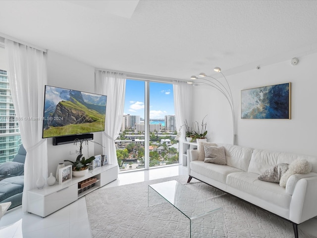 living room featuring expansive windows and a chandelier