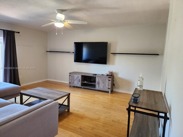 bedroom with light hardwood / wood-style flooring, ceiling fan, and access to outside