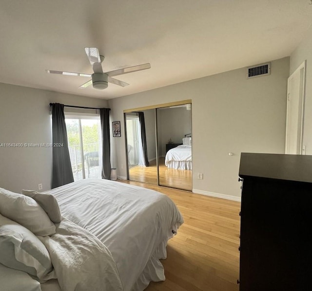 bedroom featuring a closet, ceiling fan, access to outside, and light wood-type flooring