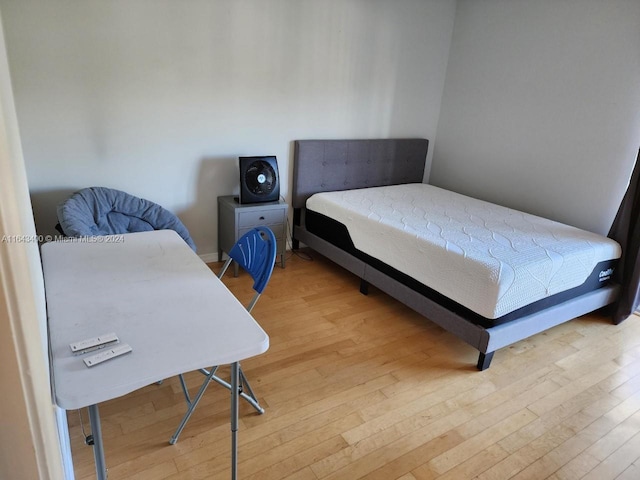 bedroom with light wood-type flooring