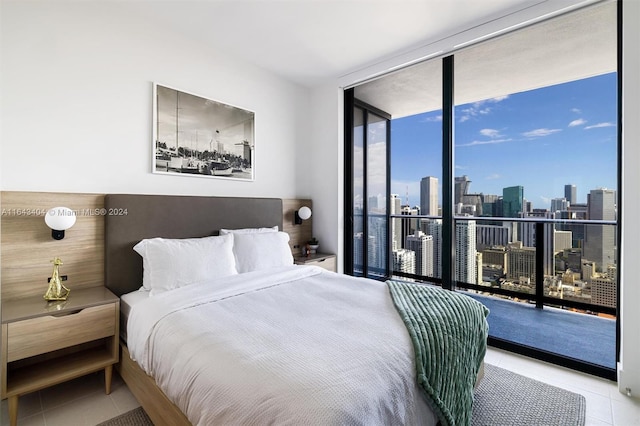 tiled bedroom featuring access to outside and floor to ceiling windows