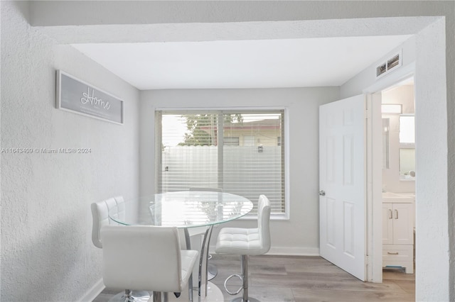 dining room with light hardwood / wood-style floors