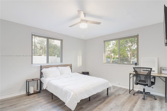 bedroom featuring ceiling fan and light wood-type flooring