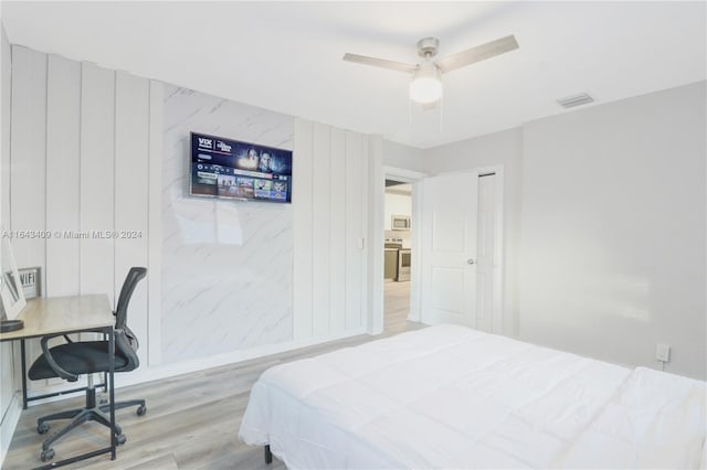 bedroom featuring ceiling fan and hardwood / wood-style floors