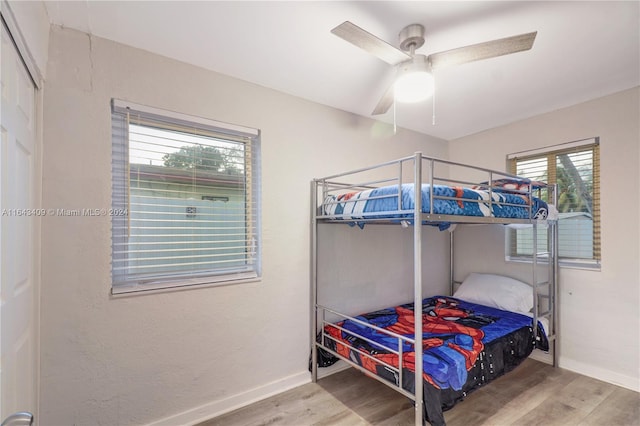 bedroom with ceiling fan and light wood-type flooring