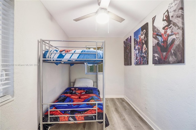 bedroom featuring ceiling fan and hardwood / wood-style flooring