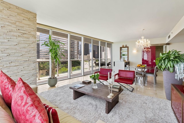 living room featuring expansive windows, visible vents, and an inviting chandelier