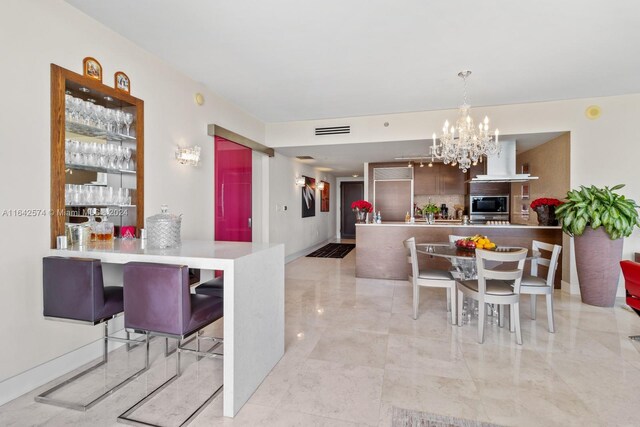 interior space featuring a notable chandelier and light tile patterned floors