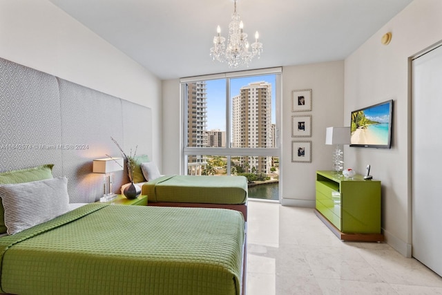 bedroom featuring a chandelier, floor to ceiling windows, and baseboards