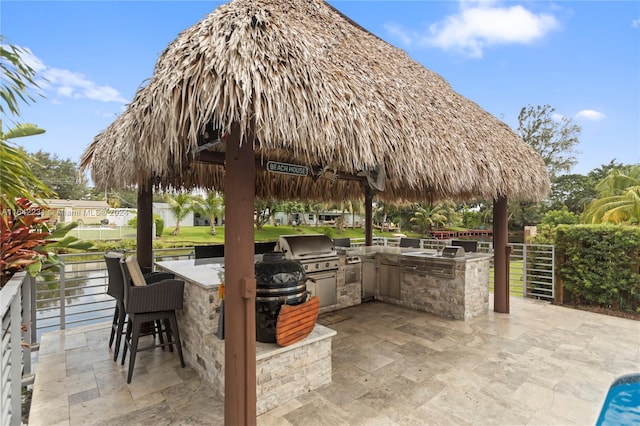 view of patio featuring a gazebo and area for grilling