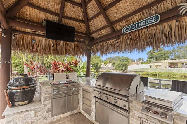 view of patio / terrace featuring grilling area, exterior kitchen, and a gazebo