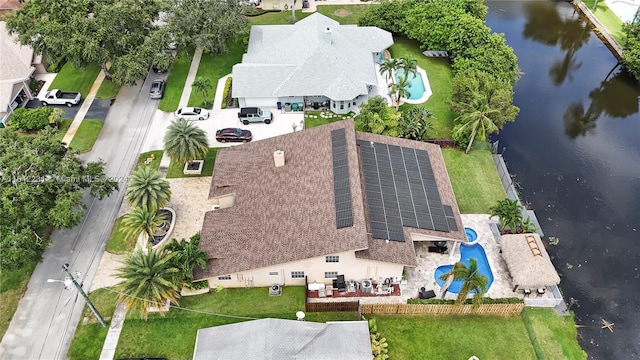 birds eye view of property with a water view