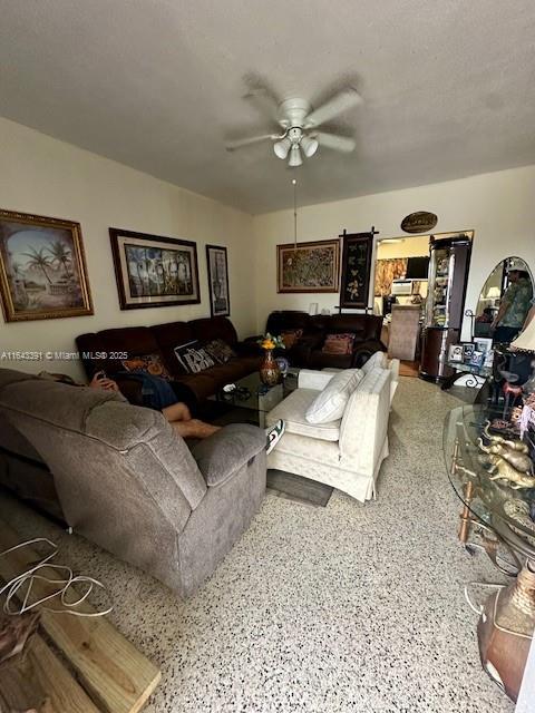 living room featuring ceiling fan