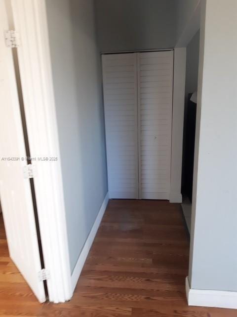 hallway featuring hardwood / wood-style flooring