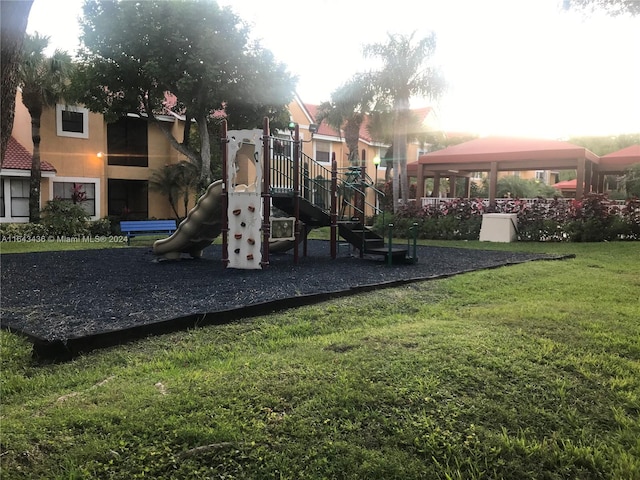 view of play area featuring a gazebo and a lawn