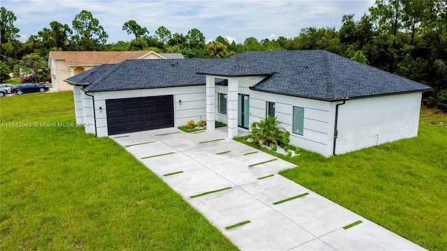 ranch-style house featuring a garage and a front yard