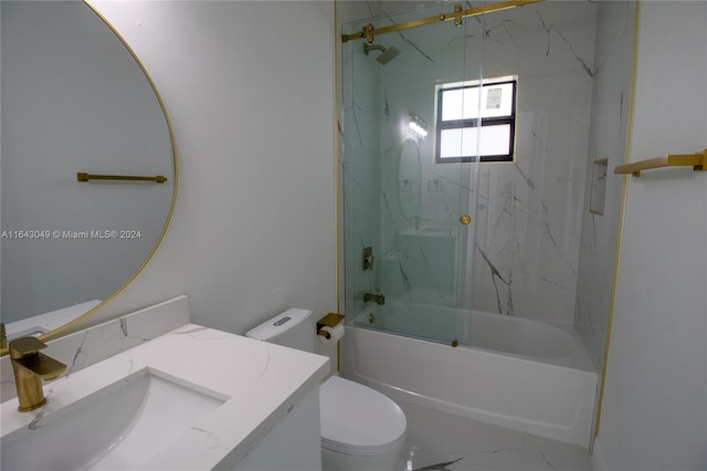 full bathroom featuring tile patterned flooring, tiled shower / bath, toilet, and vanity