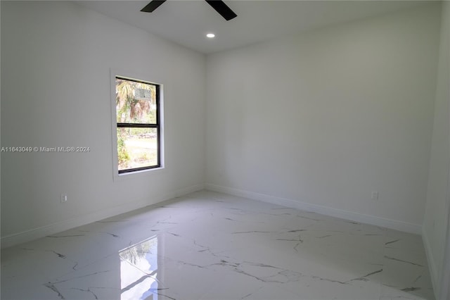 unfurnished room with ceiling fan