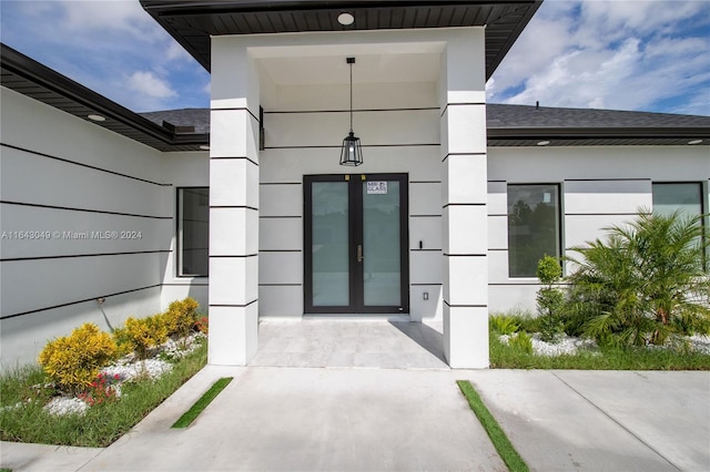 doorway to property featuring french doors