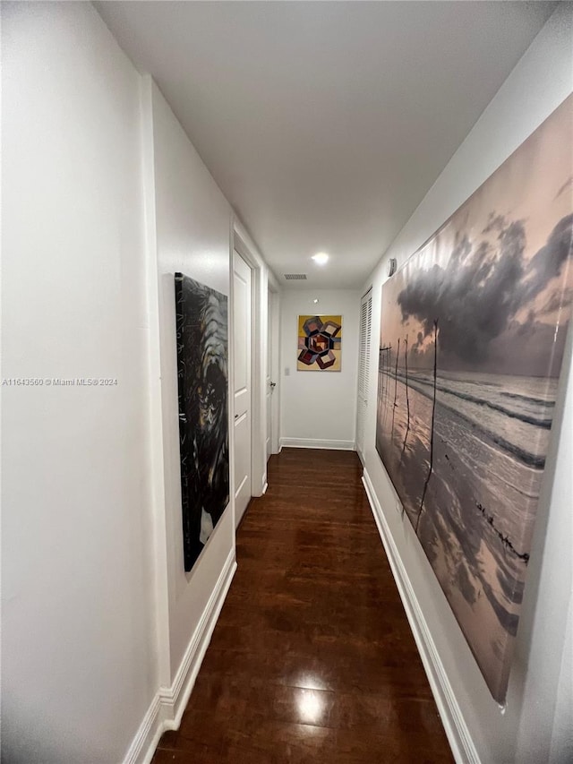 hallway featuring dark wood-type flooring