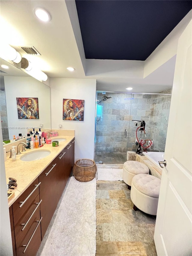 bathroom with vanity and plus walk in shower