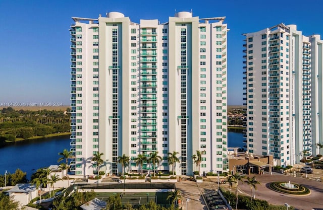 view of building exterior with a water view