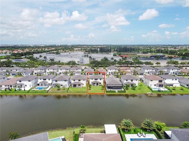 aerial view with a residential view and a water view