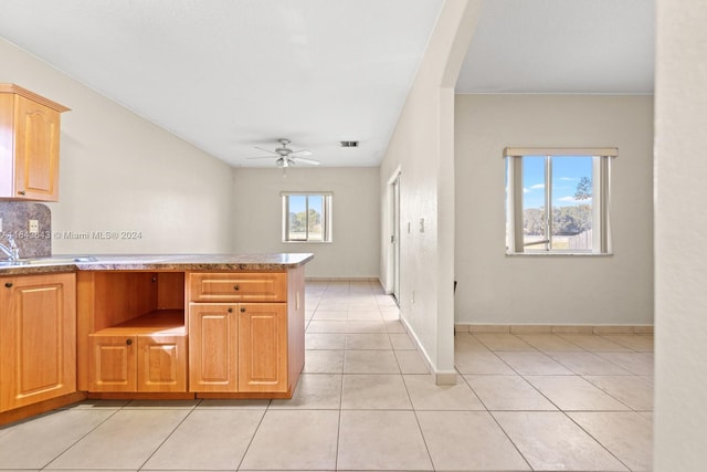 kitchen with ceiling fan, light brown cabinets, and light tile patterned floors