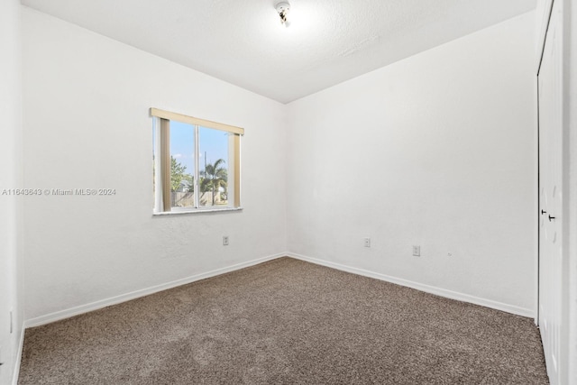 unfurnished room featuring carpet flooring