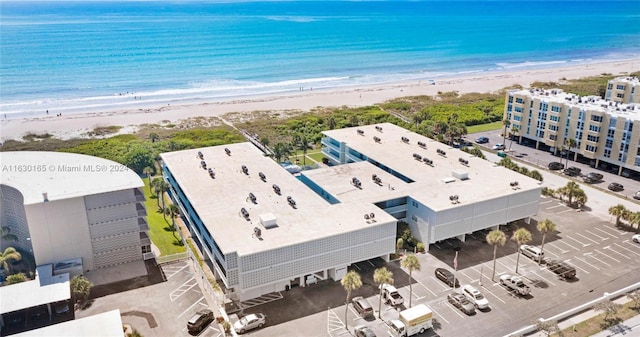 aerial view with a water view and a view of the beach