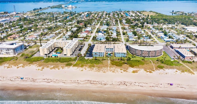 aerial view with a view of the beach and a water view