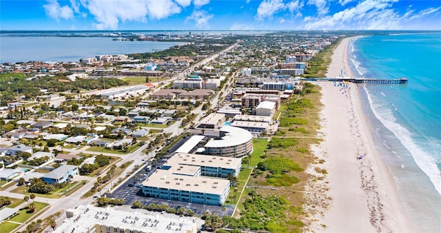 aerial view with a water view, a beach view, and a city view