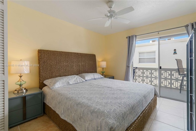 bedroom with ceiling fan, light tile patterned flooring, and access to exterior