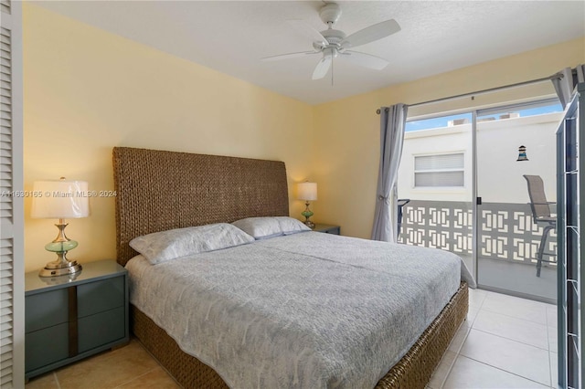 bedroom featuring light tile patterned floors, ceiling fan, and access to exterior