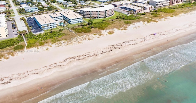 bird's eye view with a beach view and a water view