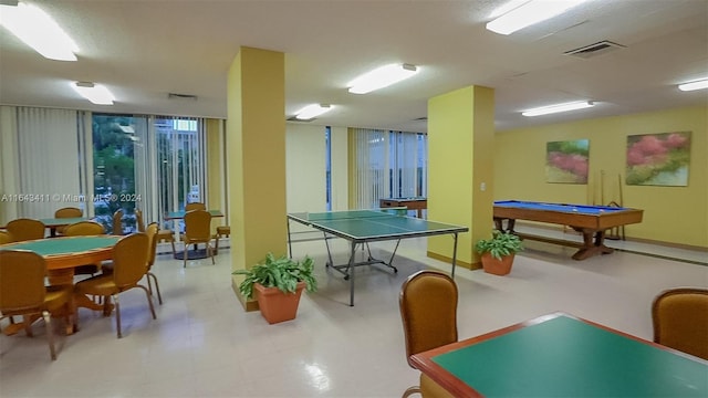 rec room with billiards, a wall of windows, and light tile patterned floors