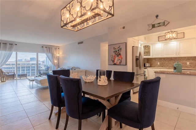 dining area featuring light tile patterned floors