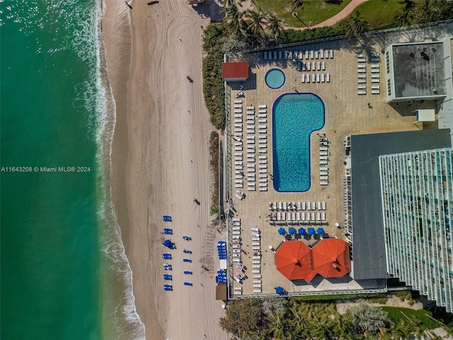 bird's eye view with a beach view and a water view