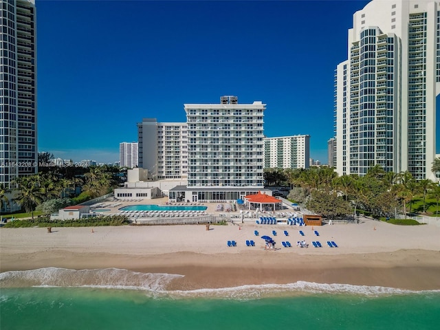 bird's eye view featuring a beach view and a water view