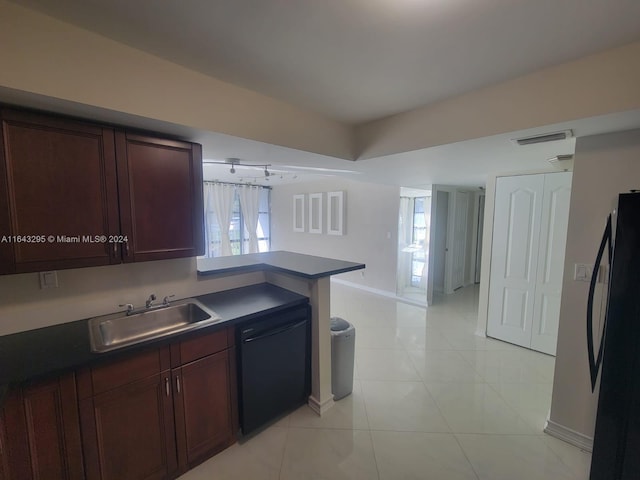 kitchen with sink, kitchen peninsula, black appliances, and a healthy amount of sunlight