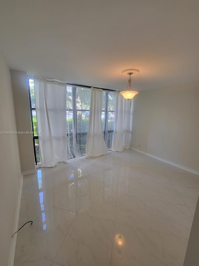 empty room featuring floor to ceiling windows