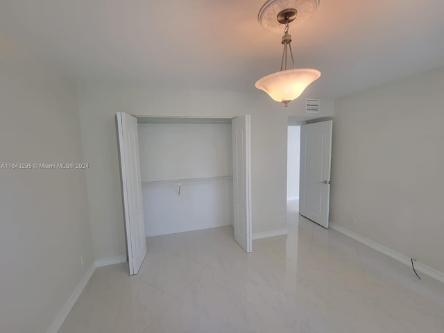 unfurnished bedroom with a closet