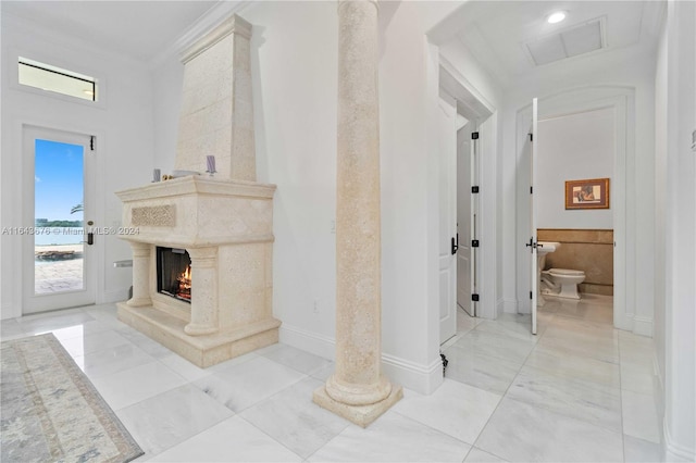 interior space with a fireplace and ornamental molding